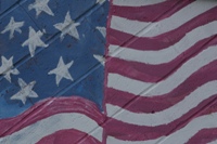 U.S. flag painted on a cement block wall